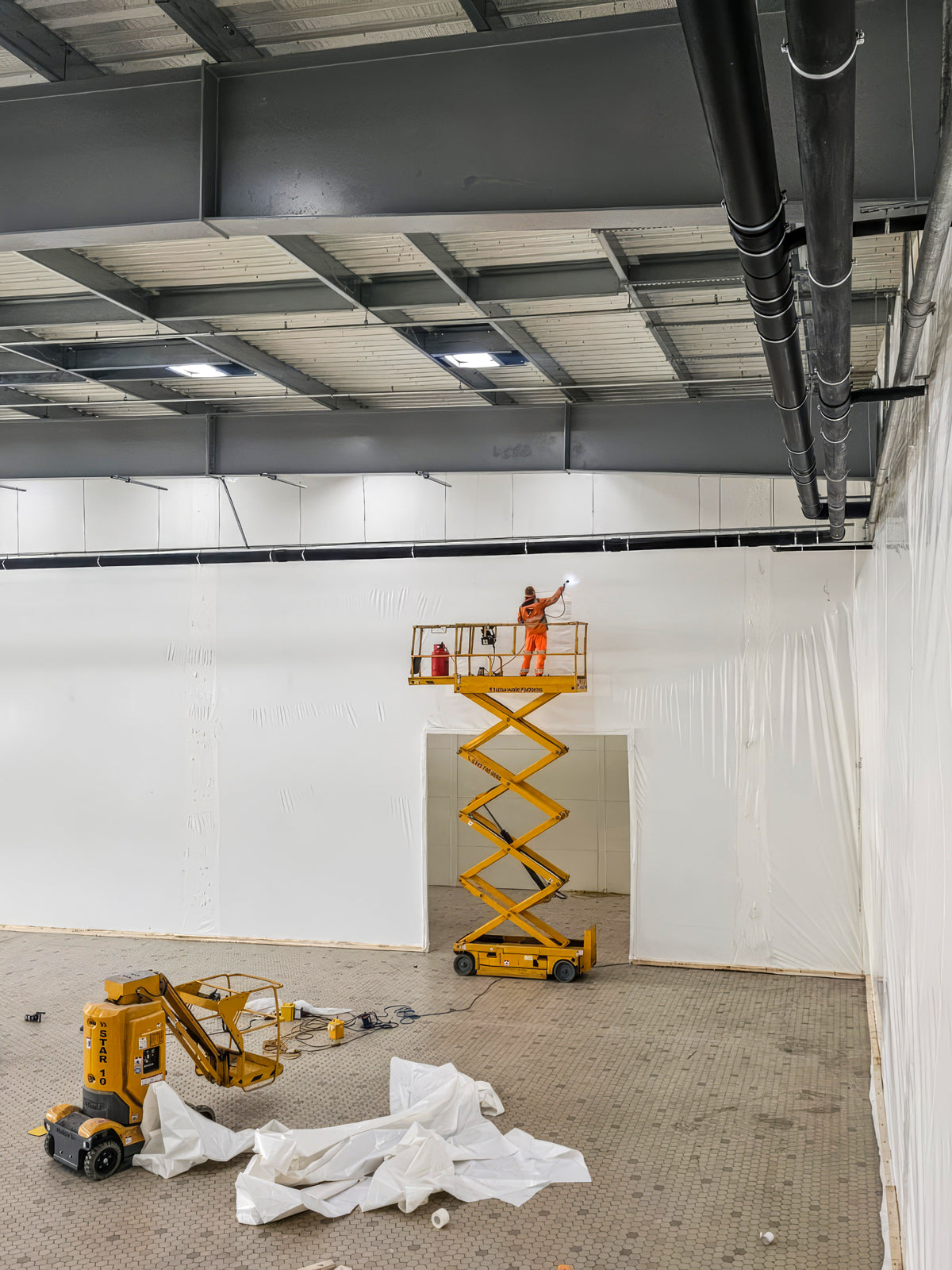 Warehouse Partitions | Dust & Debris Containment by Rhino Shrink Wrap®