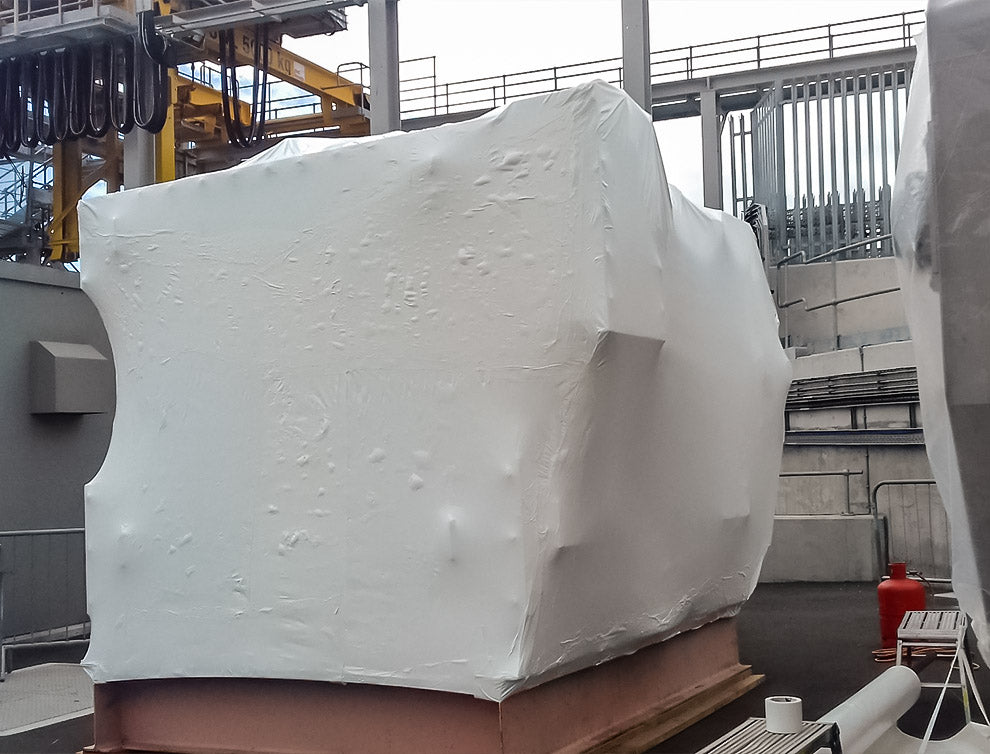 Industrial equipment shrink wrapped for weather protection using Rhino 8m film