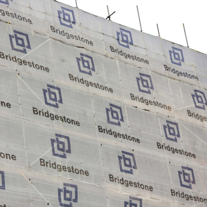 Branded Scaffold Debris Netting on a scaffolding structure.